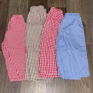 Four pairs of plaid pants